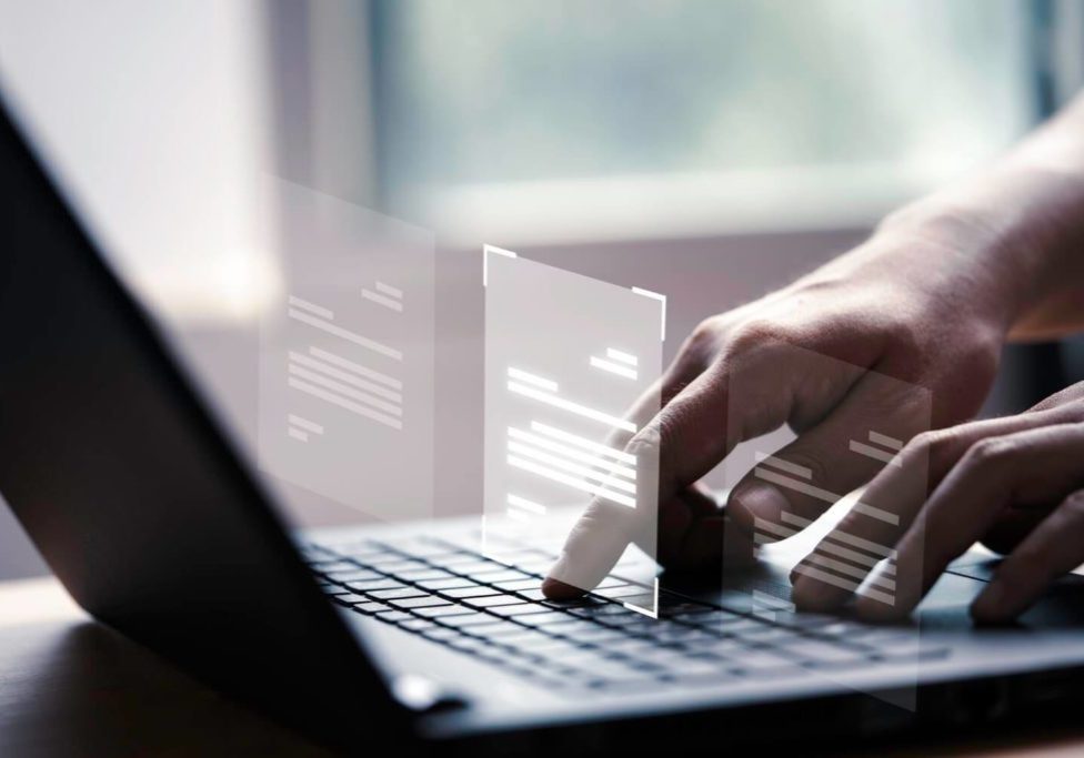 hand-using-laptop-computer-with-virtual-screen-document-online-approve-paperless-quality-assurance-erp-management-concept