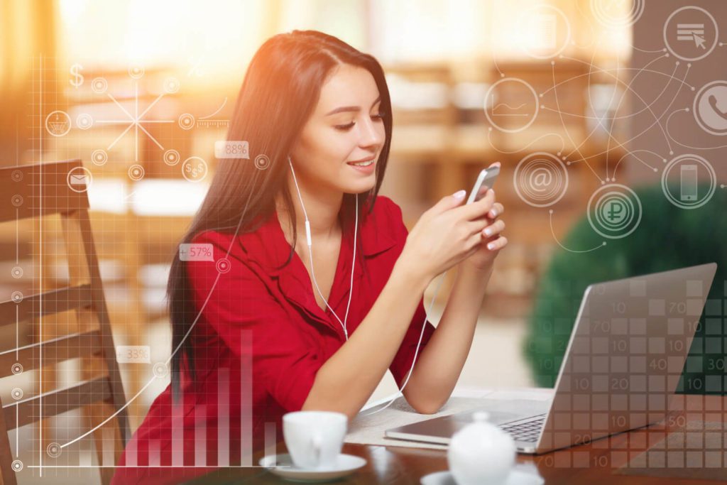 elegant-woman-with-laptop-listening-music