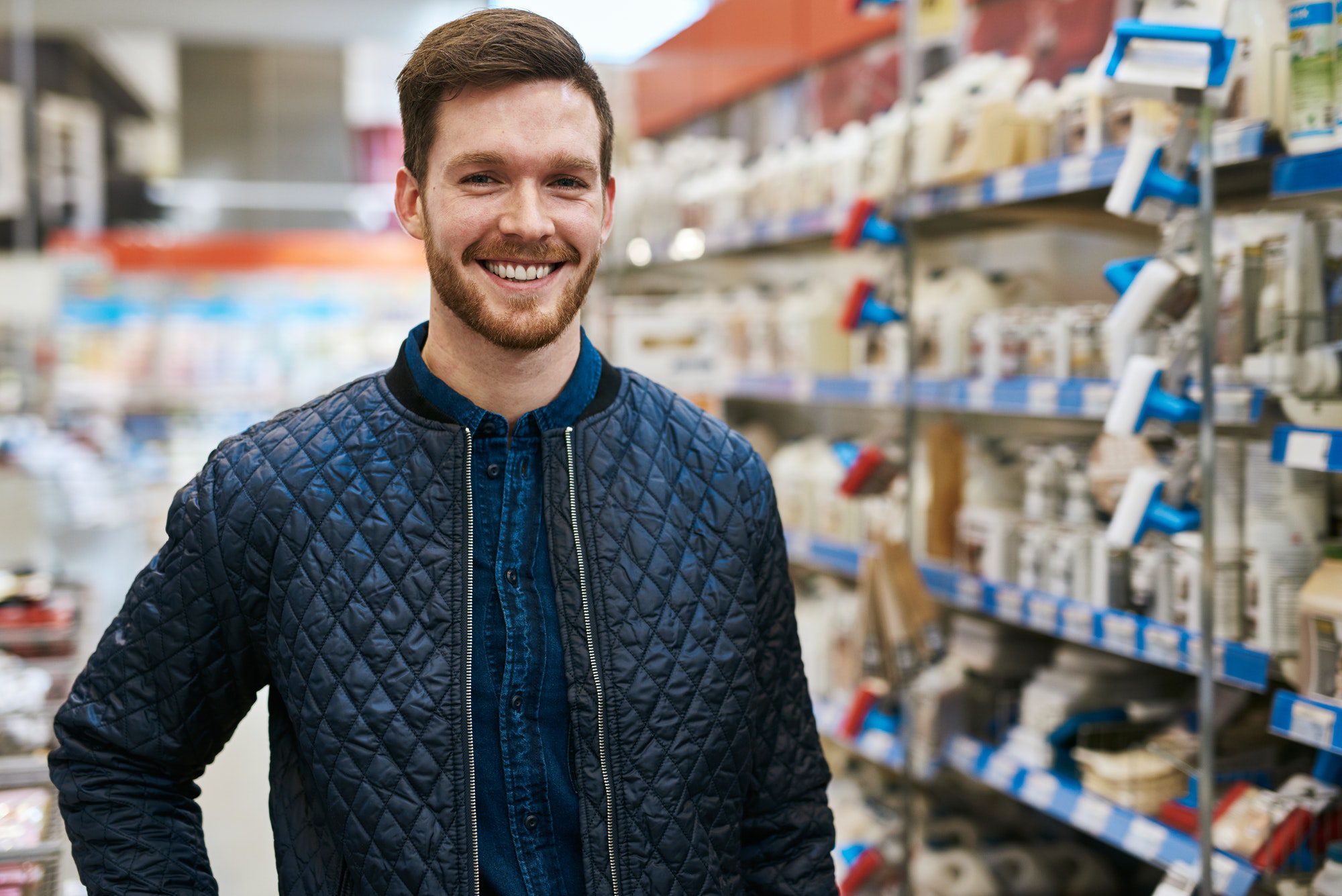 Friendly handsome man in a hardware store