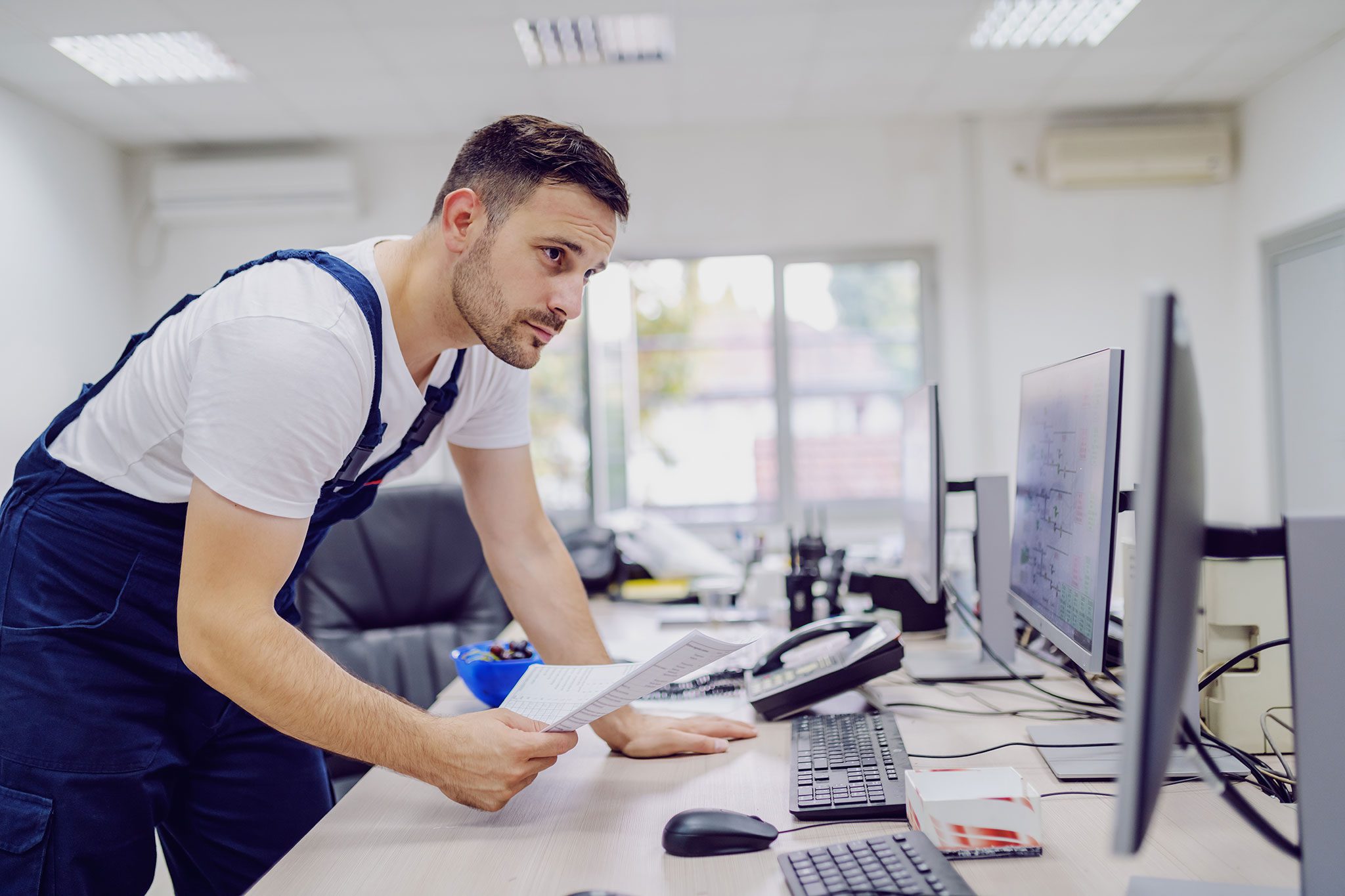 worker looking at orders on computer